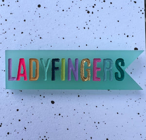 Ladyfingers Blue Acrylic Banner Pin